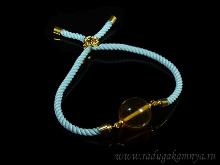 Bracelet with amber on a twisted blue cord, 14mm honey ball, 22cm