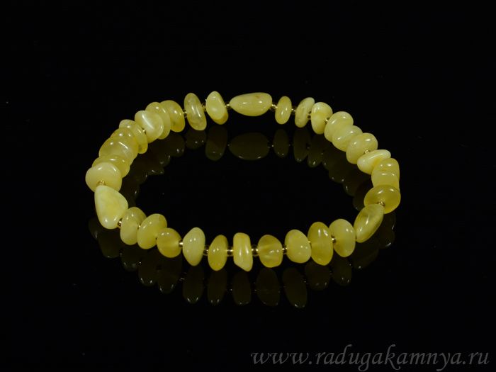 Amber bracelet with beads of color. milky honey