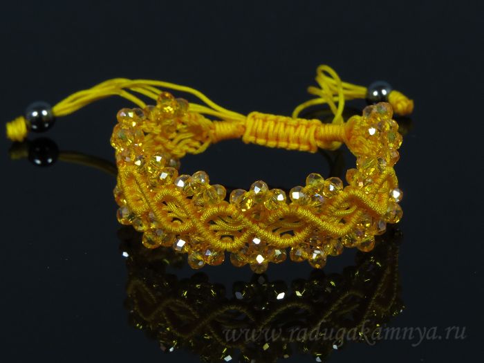 Braided bracelet with zircons colored orange