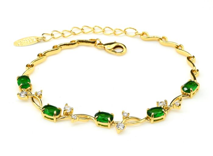 Women's bracelet on the arm "Twig" with green zircon