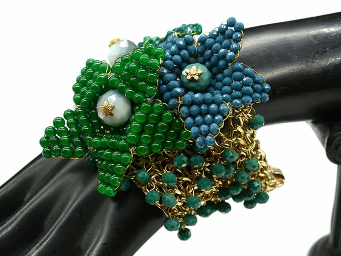 A bracelet with zircons on metal.The base of the "Three flowers" is the author's, 19cm